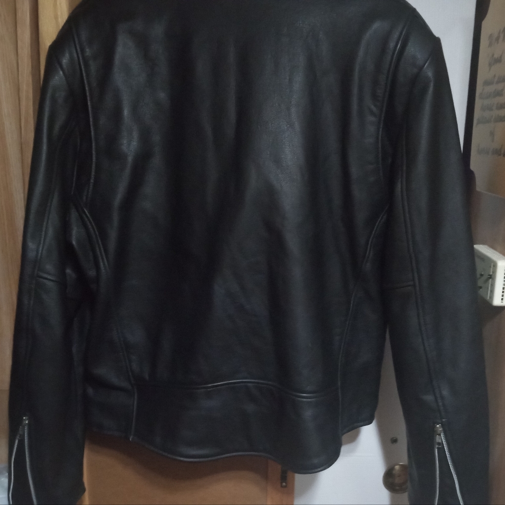 Heavy Biker Leather jacket ,worn about 3 times,I don't have a bike ..
